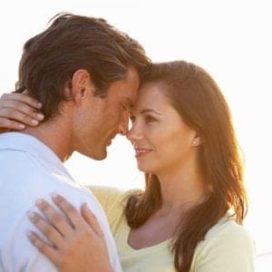 Romantic Young couple in love at sunset