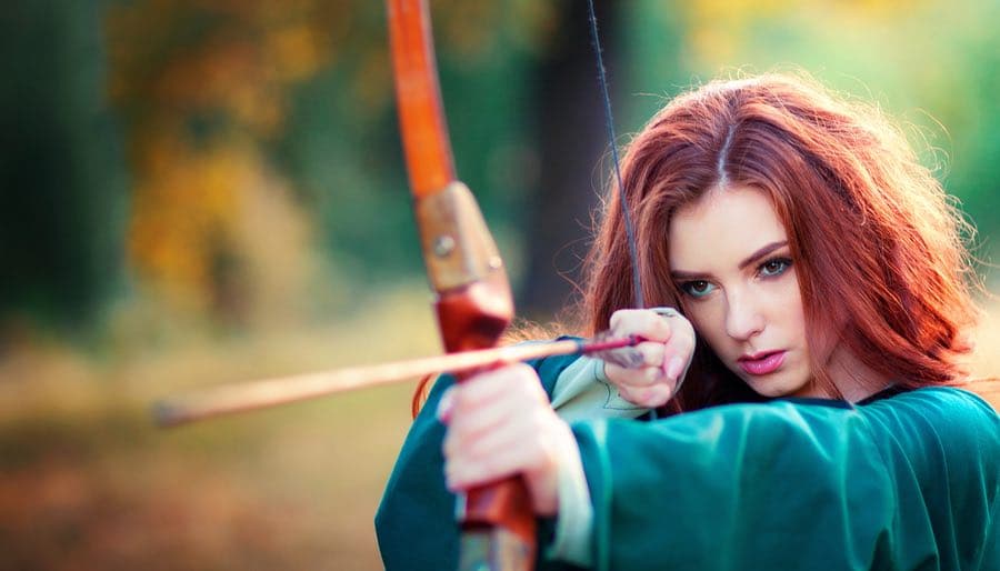 Red Haired Woman Archer Shooting Bow & Arrow