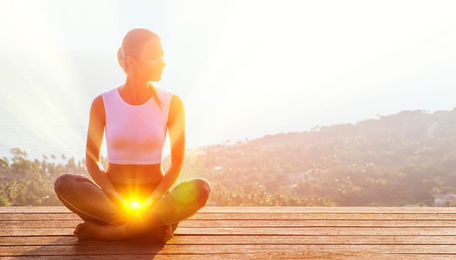 Woman on deck with Sacral Chakra Activated