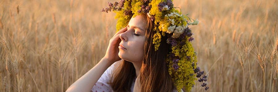 woman in field celebrating imbolc festival