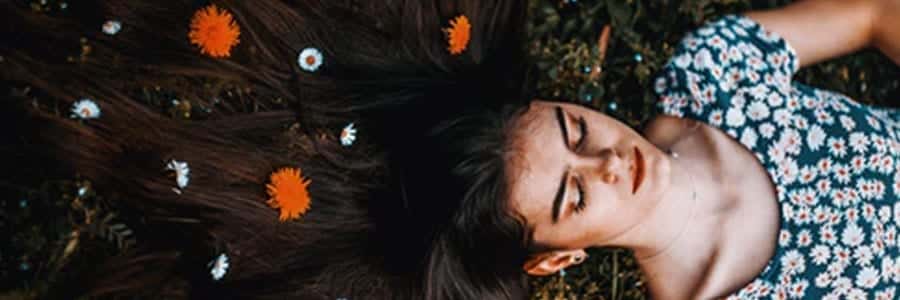 woman lying on the ground asleep