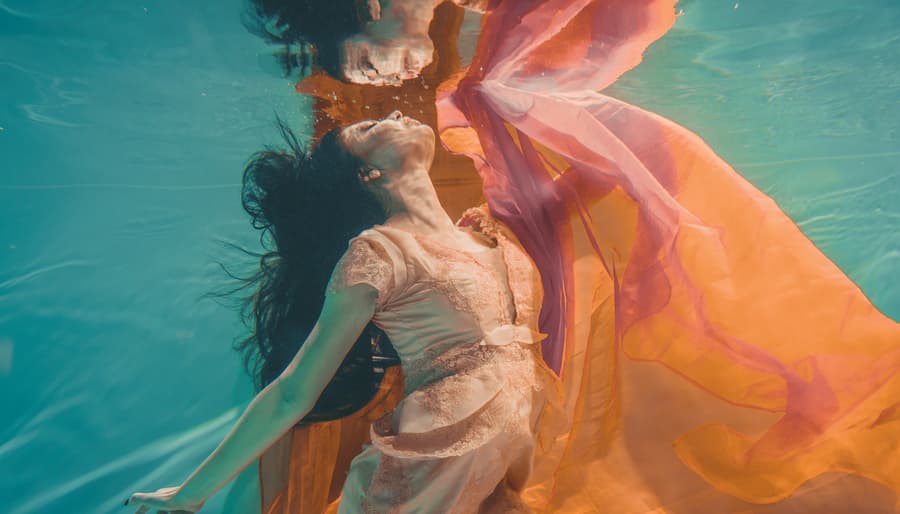 Woman Underwater in Floaty Orange Dress