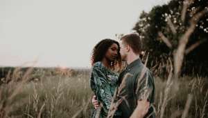 Romantic Couple in Field at Dusk