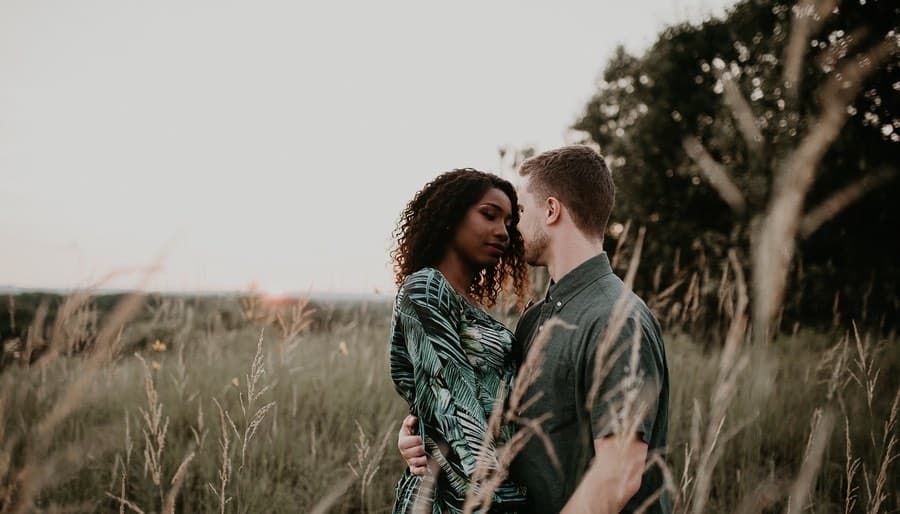 Romantic Couple in Field at Dusk