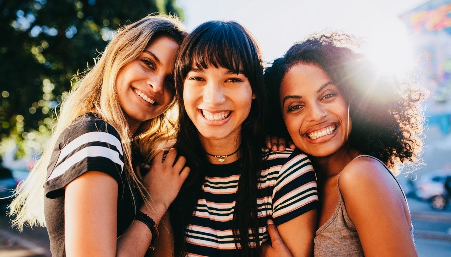 3 Young Woman Smiling in a Selfie