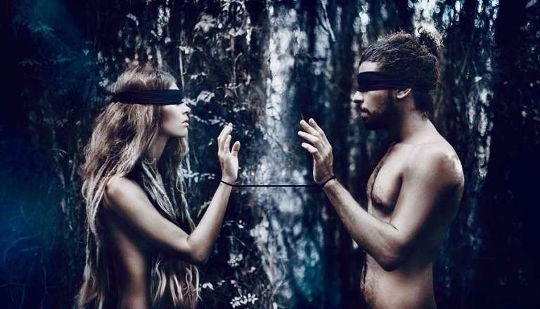 Blindfolded Couple in Forest