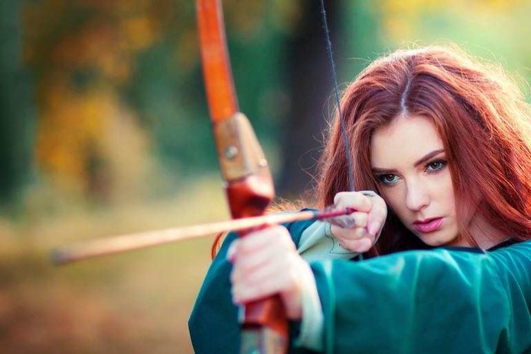 Red Haired Woman Archer Shooting Bow & Arrow