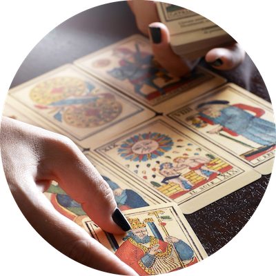 Tarot Card Reader Hands Performing Reading and Placing Cards in Spread