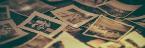 old family photographs scattered on the floor