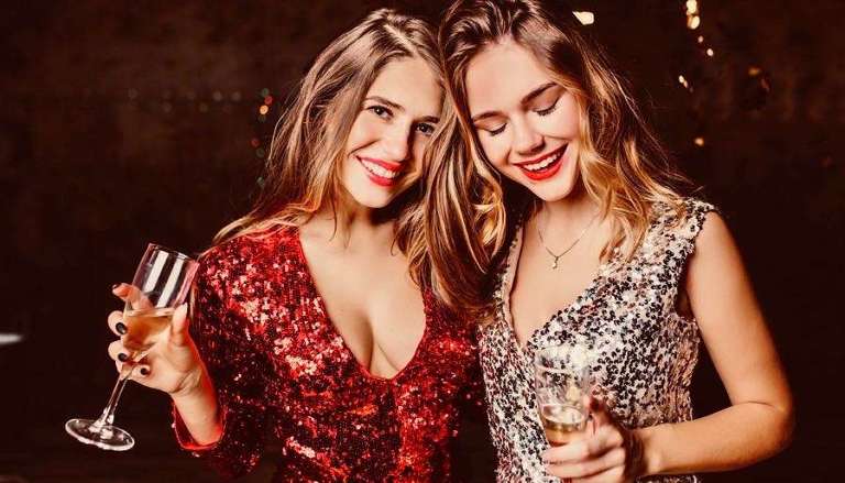 2 Young Female Friends in Sparkly Party Dresses