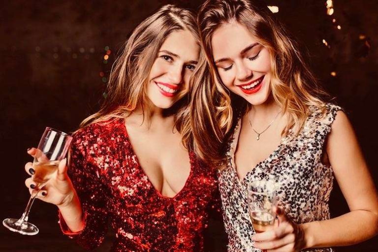 2 Young Female Friends in Sparkly Party Dresses
