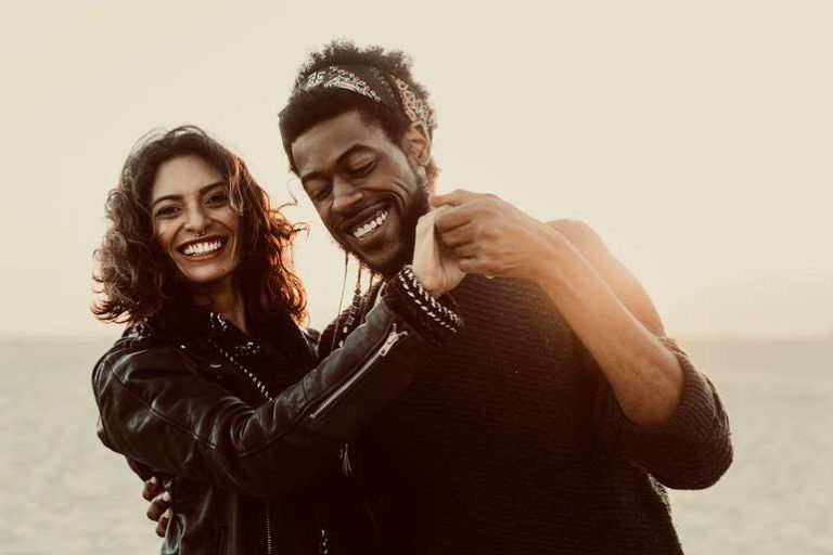 Happy, Laughing Couple wearing Leather Jackets