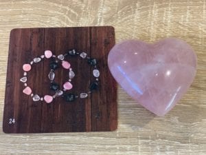 Rose Quartz Heart Crystal with Two Crystal Bracelets Overlapping Oracle Card